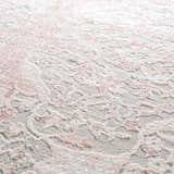 Close-up of the Zora Pink Area Rug showing its traditional floral pattern and soft, textured pile. Texture