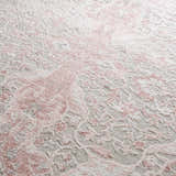 Close-up of the Zora Pink Area Rug showing a traditional vintage floral pattern in pink, gray, and ivory. Texture
