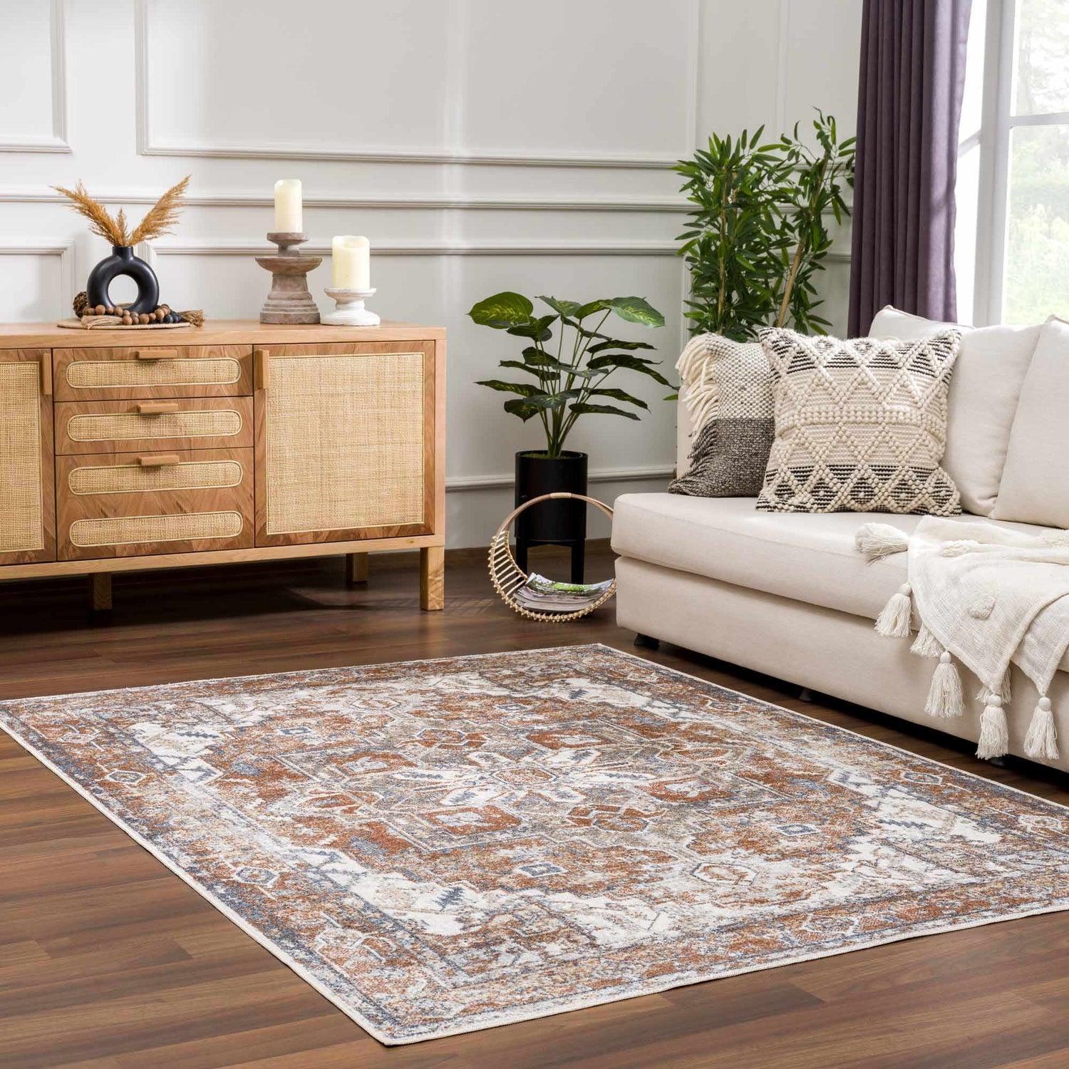 Living room with a Rust Hera Washable Area Rug, cream sofa, wood cabinet, and plants. Farmhouse style. Roomscene-Rectangle