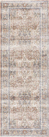 Close-up of the Arias Blue Boutique Washable Rug, showcasing its faded driftwood, nutmeg, and blue traditional pattern. Design-Runner-2773