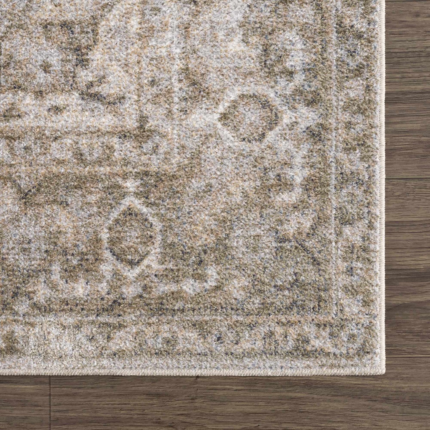 Close-up of the Gael Boutique Washable Rug. Traditional, vintage style with light blue, olive, tan and yellow tones. Swatch