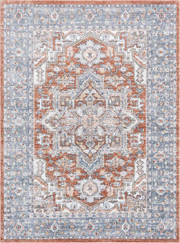 Close-up of Ember Washable Area Rug in beachhouse, charcoal, and copper. Traditional style with a detailed, symmetrical pattern. Design-Rectangle-5373