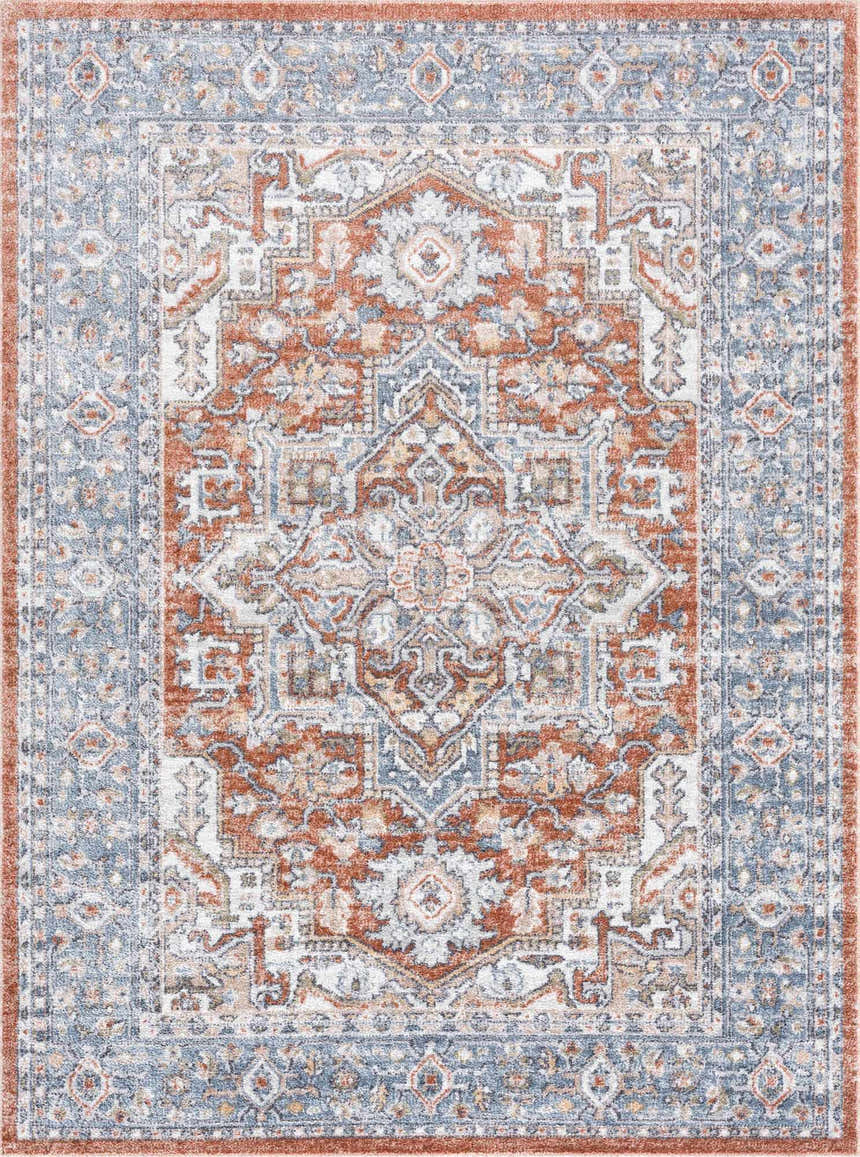 Close-up of Ember Washable Area Rug in beachhouse, charcoal, and copper. Traditional style with a detailed, symmetrical pattern. Design-Rectangle-5373
