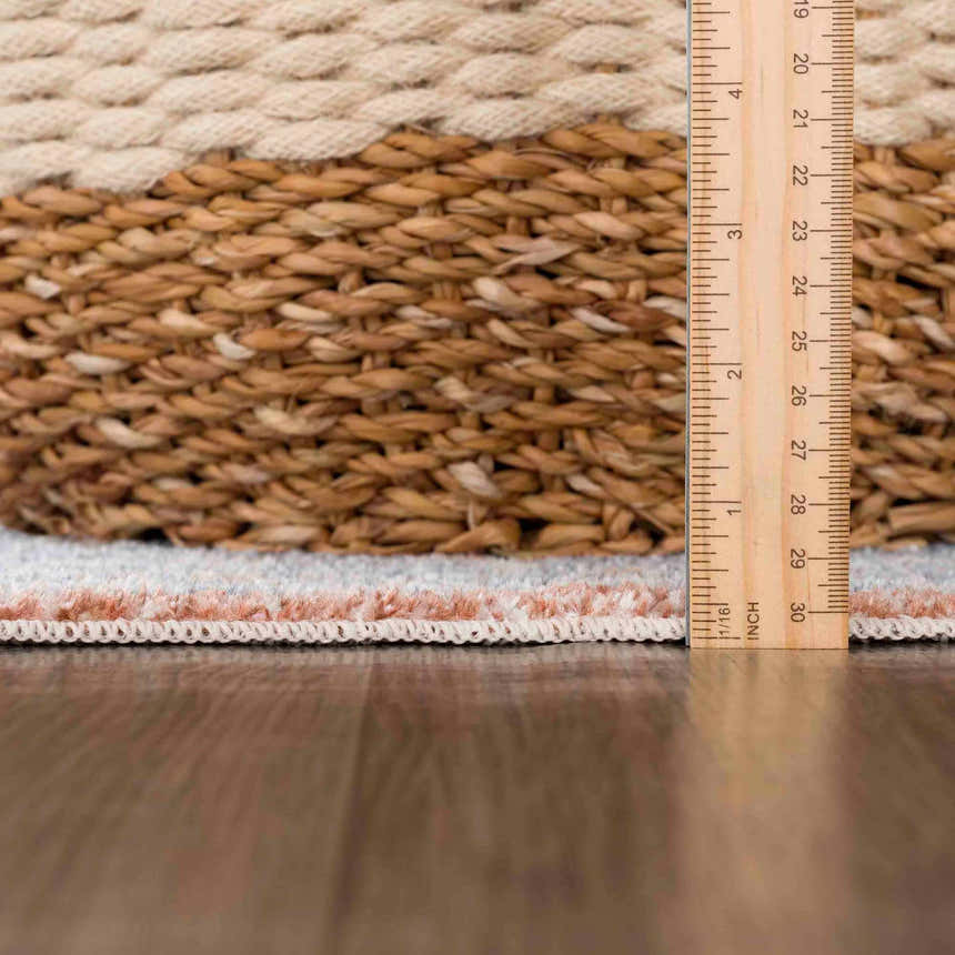 Close-up of Ember Washable Area Rug showing Beachhouse color, woven texture, and pile height with ruler for scale. Pile