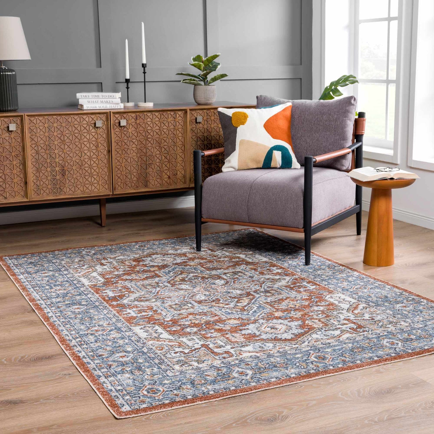 Living room scene with Ember Washable Area Rug in Beachhouse. Traditional style with blue, white, and copper tones. Roomscene-Rectangle
