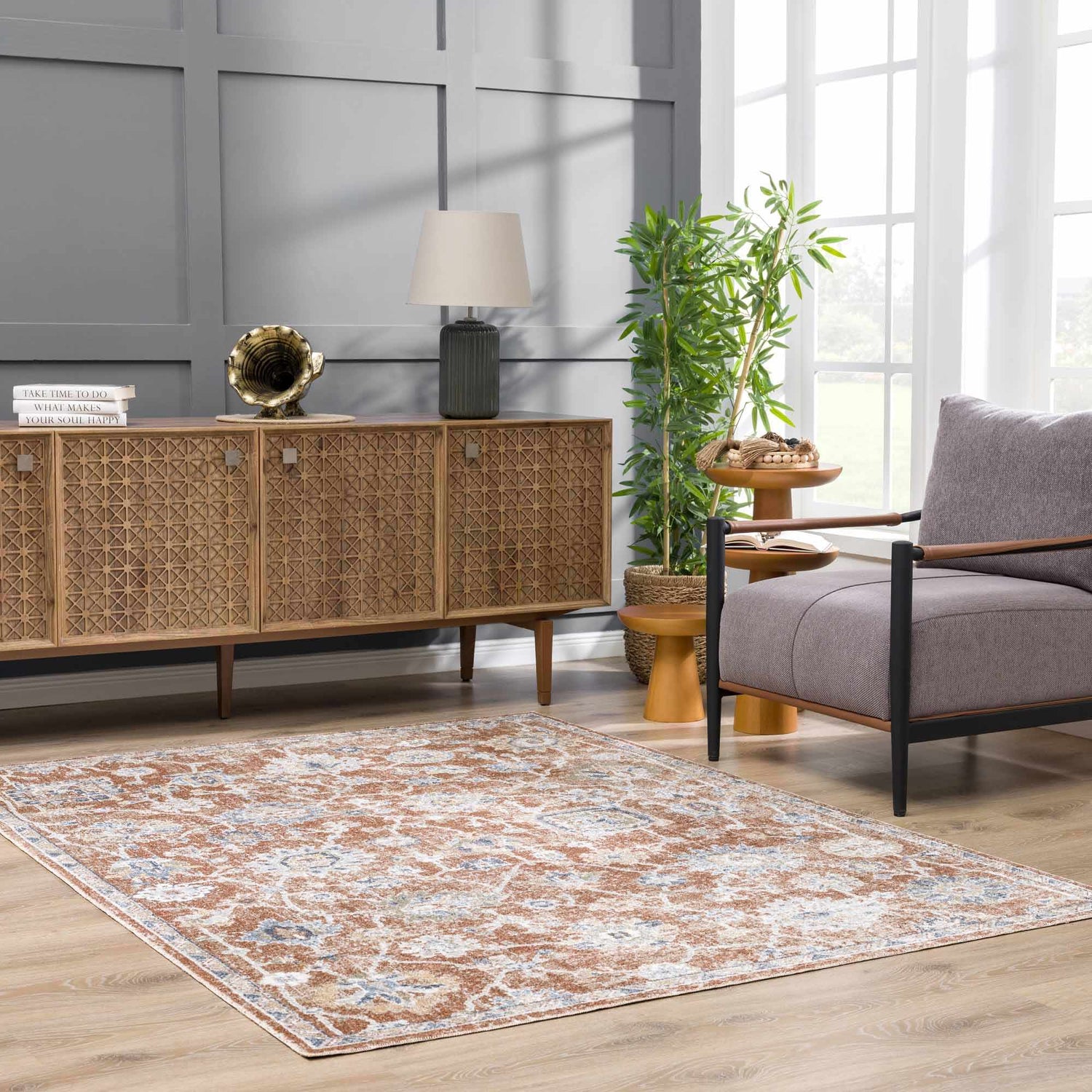 Living room scene with the Chavi Washable Area Rug in charcoal, clay, and brown tones, complementing the farmhouse style decor. Roomscene-Rectangle