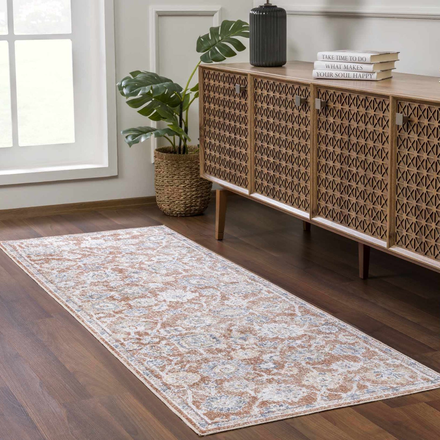 Hallway scene with a Chavi Washable Area Rug runner in charcoal, clay, and brown. Farmhouse style with wood cabinet and plant. Roomscene-Runner