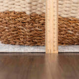 Close-up of the Neta Red & Blue Flat Pile Washable Rug showing the rug's pile height with a ruler. Pile