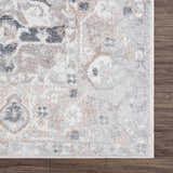Close-up of the Dobry Boutique Washable Rug. Features blue, tan, and off-white oriental pattern on a textured polyester rug. Swatch