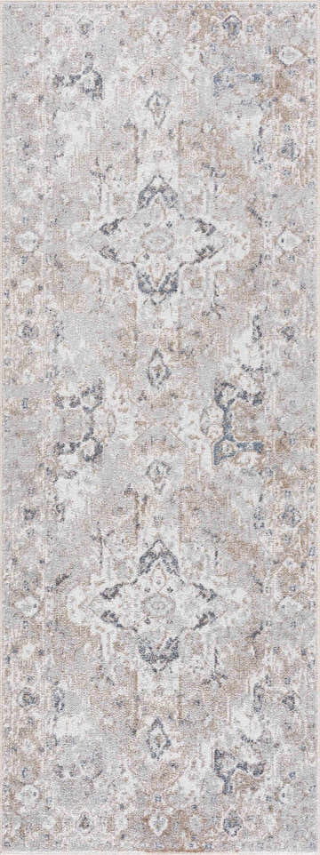 Close-up of the Dobry Boutique Washable Rug with a vintage oriental pattern in blue, off-white, and tan hues. Design-Runner-2773