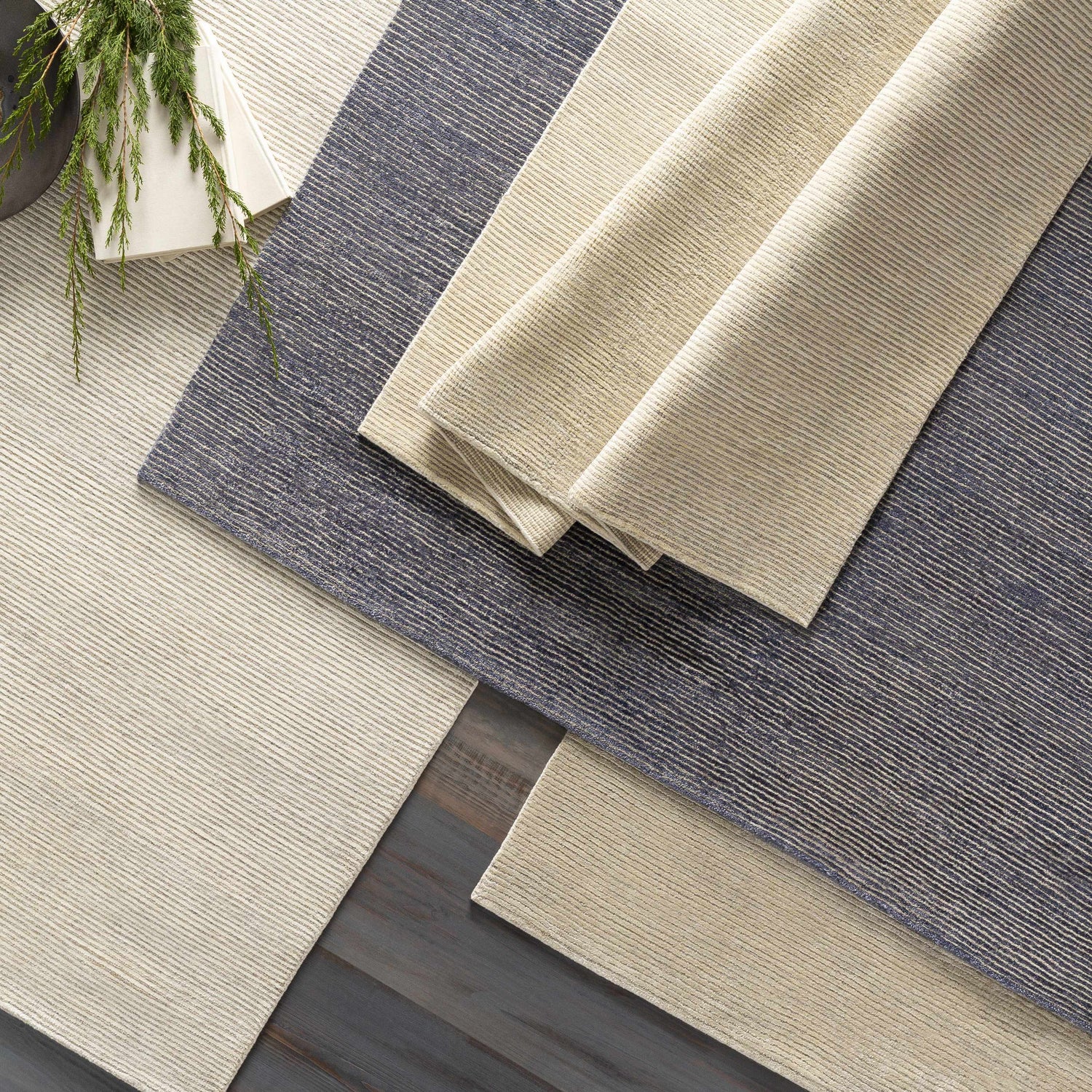 Close-up of Elco Clearance Rug in medium gray and wheat. Hand-knotted wool and viscose rug with striped design. Styleshot