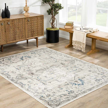 Living room scene with a Cabacungan Cream Washable Area Rug, wood cabinet, bench, and plant. Farmhouse style. Roomscene-Rectangle