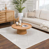 Living room scene with a white Amani Washable Rug, light wood furniture, and neutral decor. Roomscene-Rectangle