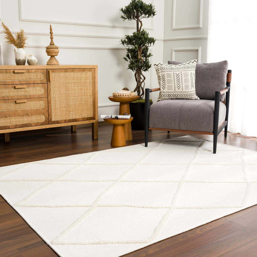 Living room scene with Amani White Washable Rug, gray chair, wood cabinet, and dark wood floors. Neutral, modern farmhouse style. Roomscene-Rectangle