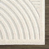 Close-up of the Deron White Washable 3D Rug. Features a geometric, curved pattern and plush texture in off-white tones. Swatch