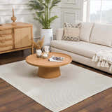 Living room with a white sofa and the Deron White Washable 3D Rug with a geometric pattern under a round wood coffee table. Roomscene-Rectangle