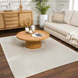 Living room with a beige sofa and a Deron White Washable 3D Rug with a geometric pattern. Roomscene-Rectangle