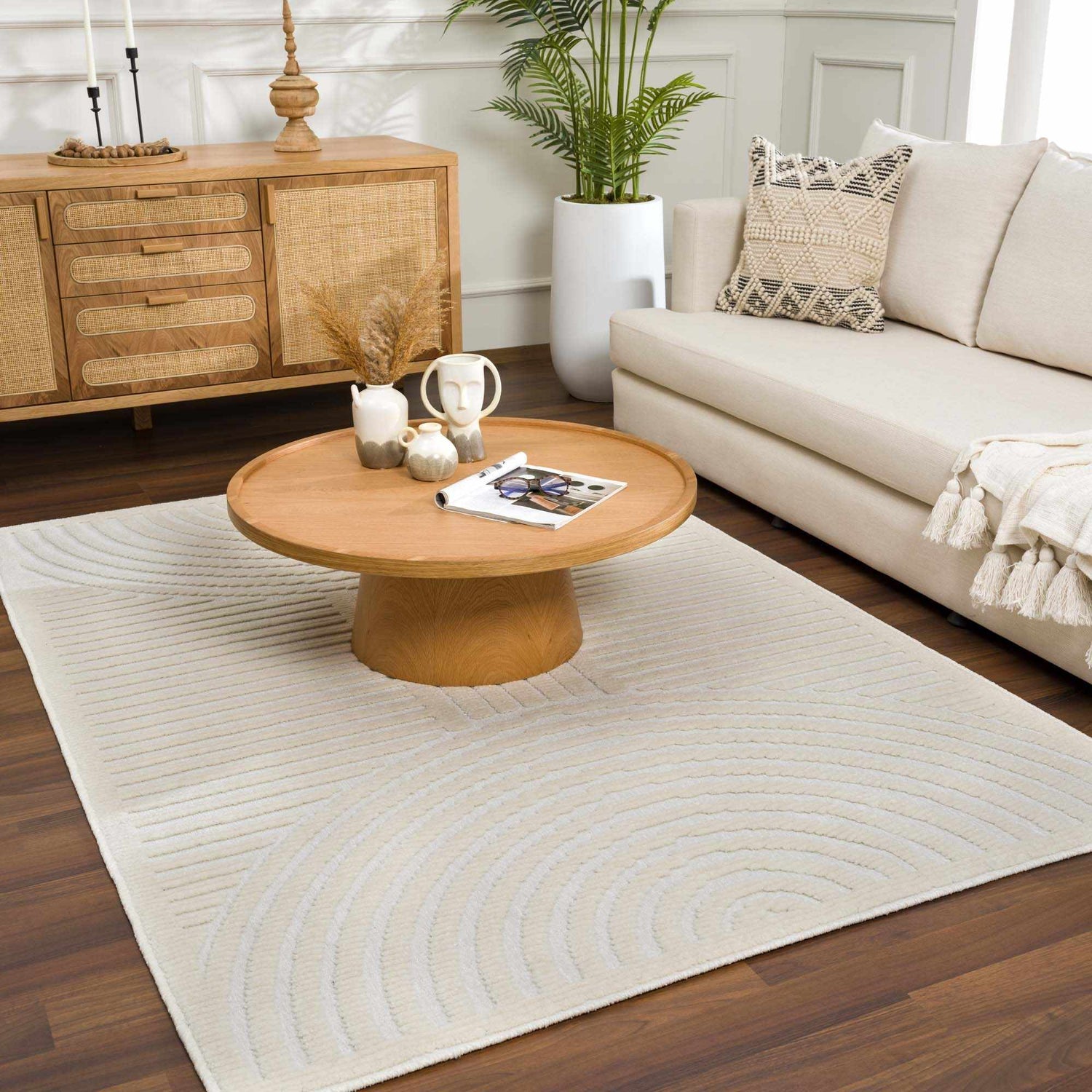 Living room with a beige sofa and a Deron White Washable 3D Rug with a geometric pattern. Roomscene-Rectangle
