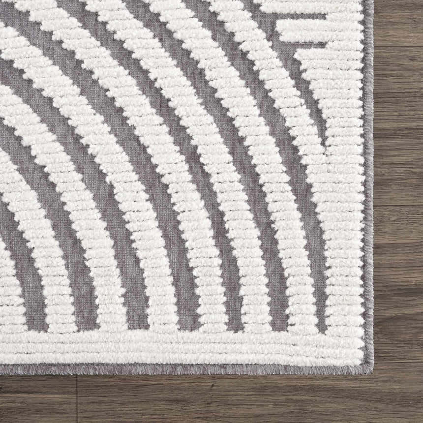 Close up of the Deron Gray Rainbow Washable Rug. Features a geometric pattern with gray and textured white stripes. Swatch