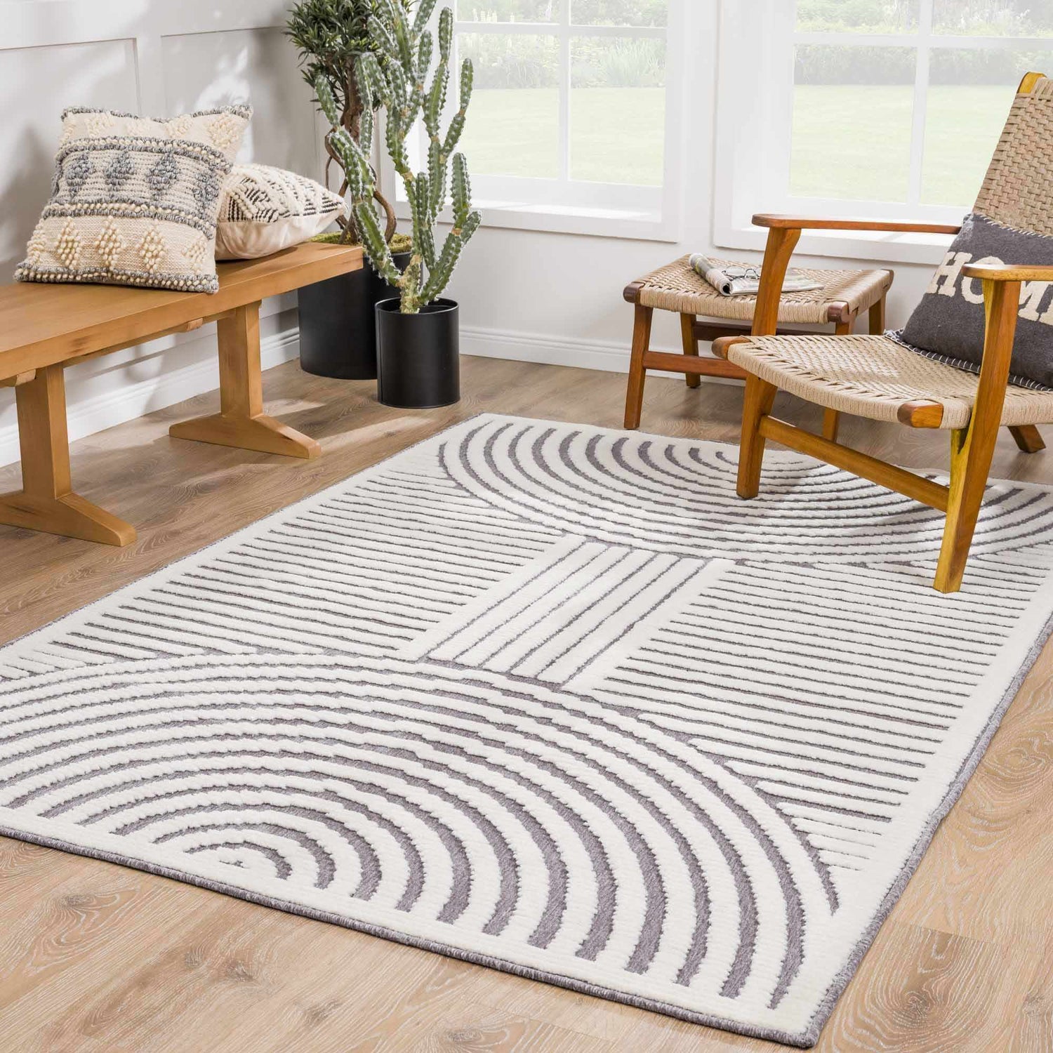 Bright living room with a gray and white geometric Deron Gray Rainbow Washable Rug. Roomscene-Rectangle