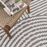 Close-up of the Deron Gray Rainbow Washable Rug showing a geometric stripe pattern in gray and white with a textured, machine-woven design. Styleshot