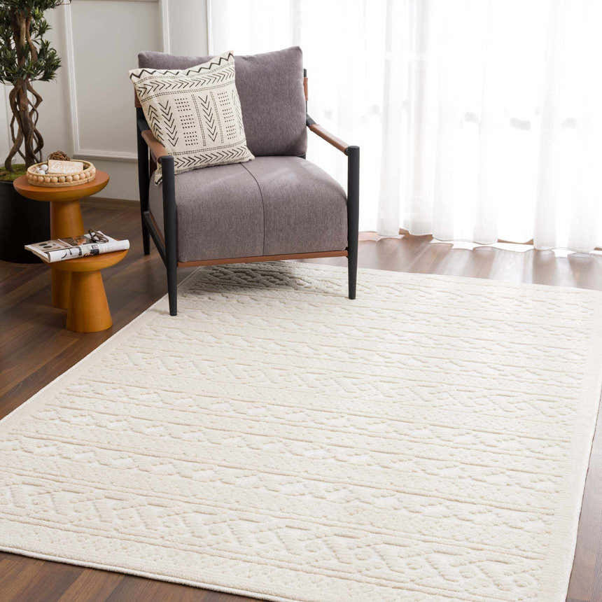 Living room scene with a Fadey White 3D Washable Rug, gray chair, wood accents, and a light, airy feel. Roomscene-Rectangle