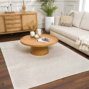 Living room scene with a Fadey White 3D Washable Rug, wood furniture, sofa, and plants for a bright, modern farmhouse look. Roomscene-Rectangle