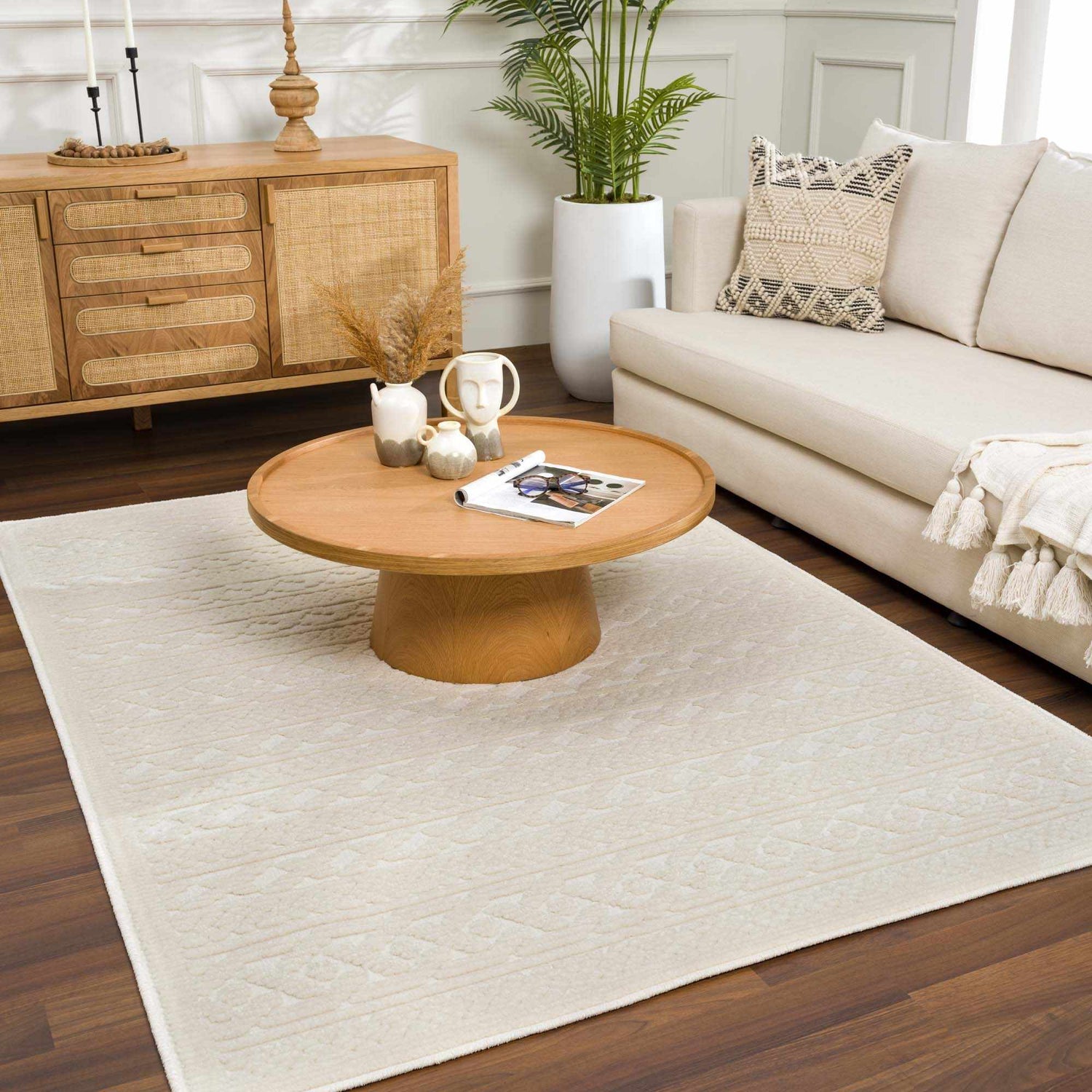 Living room scene with a Fadey White 3D Washable Rug, wood furniture, sofa, and plants for a bright, modern farmhouse look. Roomscene-Rectangle