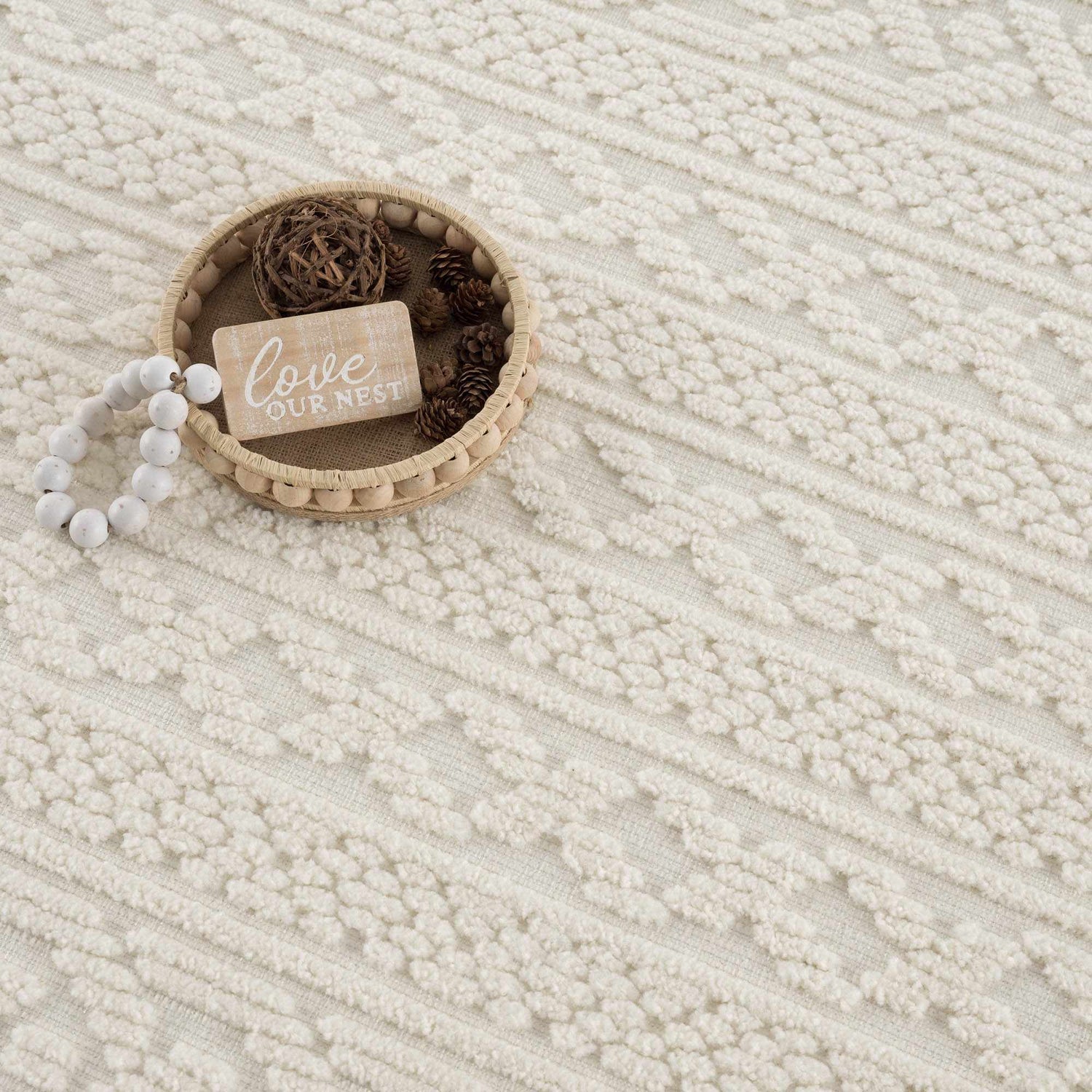 Close-up of the Fadey White 3D Washable Rug showing its geometric pattern and soft, textured design. Styleshot