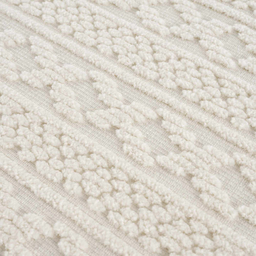 Close up of the Fadey White 3D Washable Rug, showing the geometric pattern and plush, textured pile. Texture