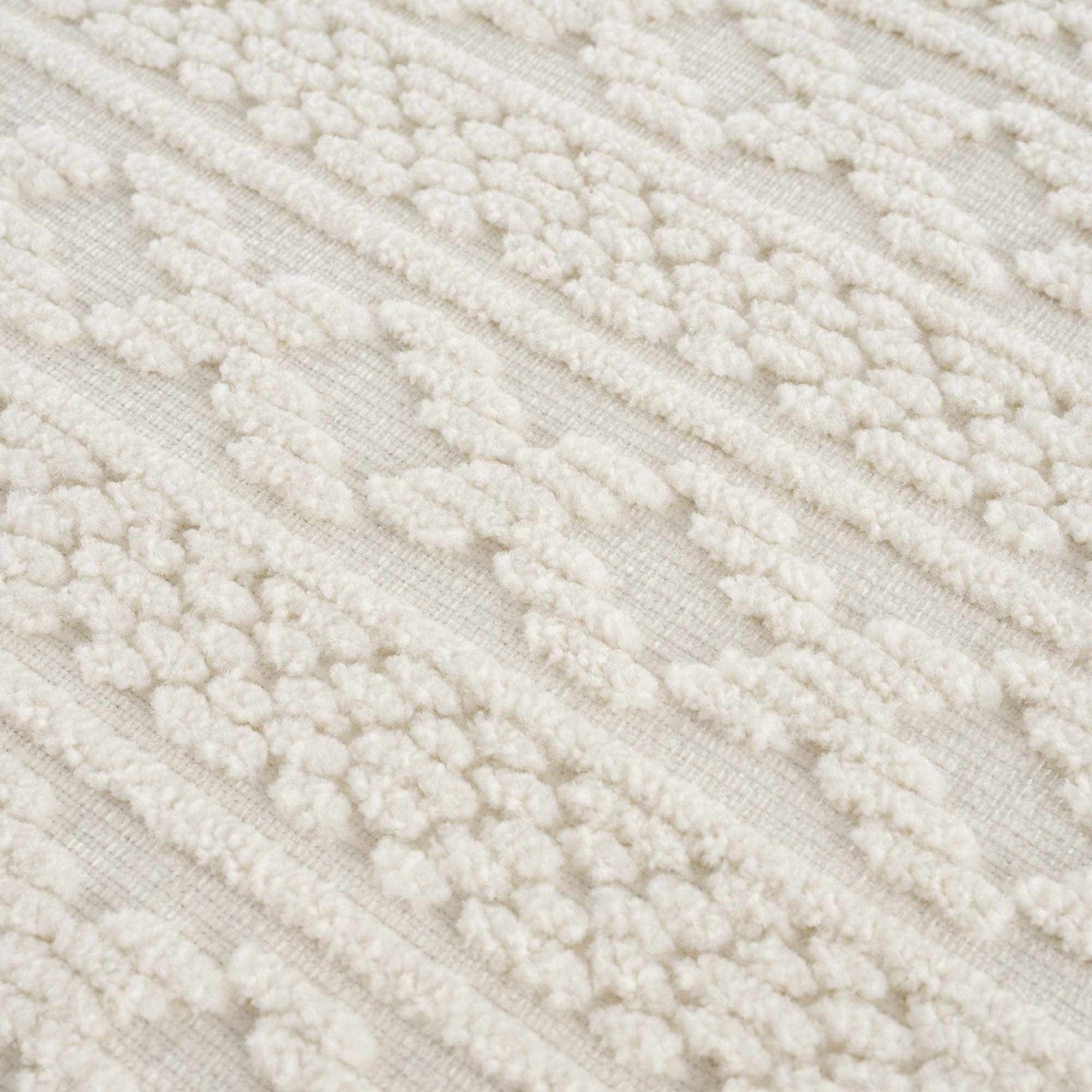 Close up of the Fadey White 3D Washable Rug, showing the geometric pattern and plush, textured pile. Texture