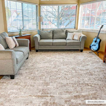 Living room scene with gray sofas and Liveri Pink Mosaic Rug, showcasing a contemporary and comfortable style. Roomscene-Rectangle