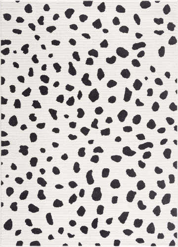Close-up of the Tariffville Dalmatian Rug, featuring a black and charcoal spot pattern on an off-white background. Design-Rectangle-5373
