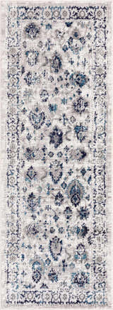 Close-up of the Duena Area Rug. Blue and light gray traditional vintage pattern, machine woven polypropylene. Design-Runner
