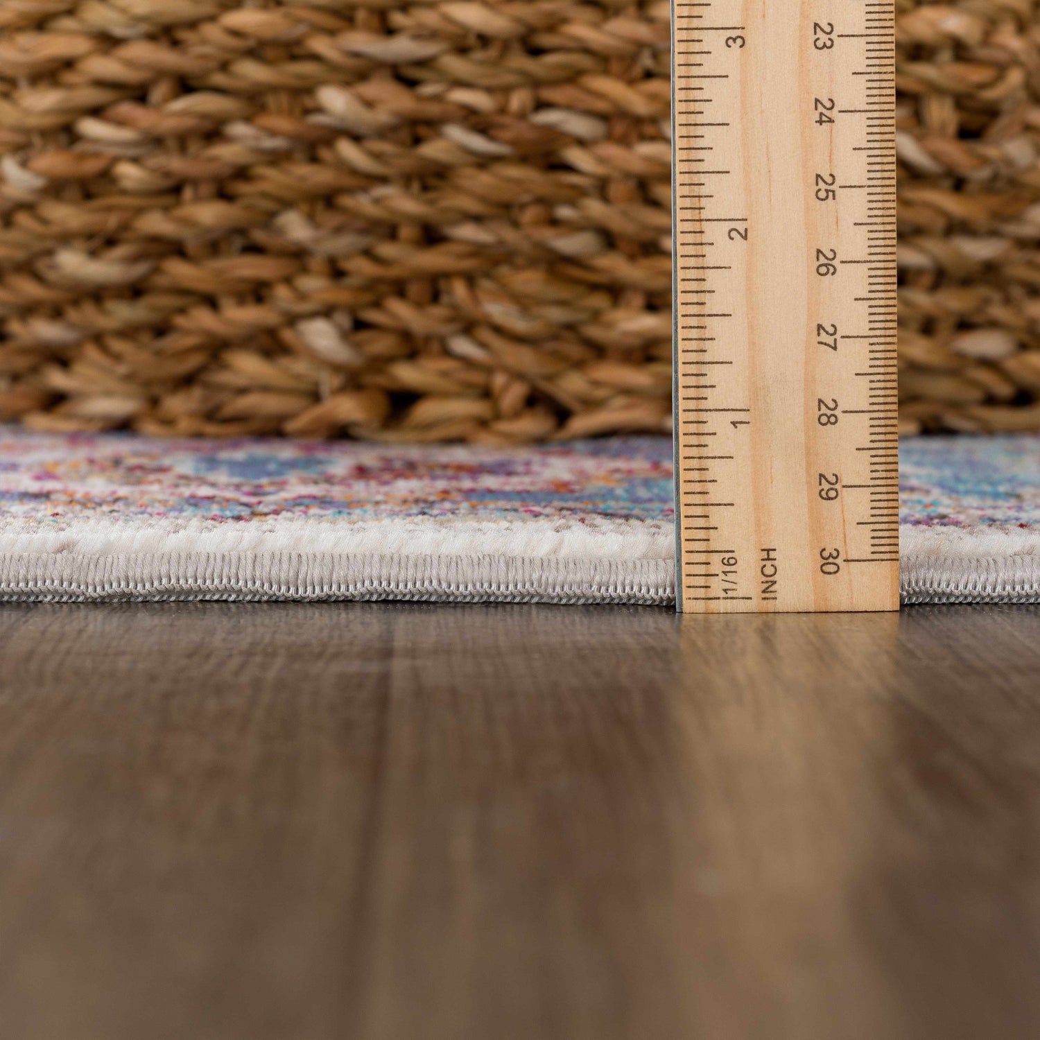 Close-up of Mardin Colorful Area Rug showing rug pile height with ruler. Bohemian style rug texture. Pile