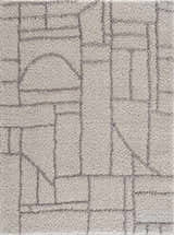 Close-up of the Andia Gray Area Rug, a shag rug with a geometric design in silver and silver-gray polyester. Design-Rectangle-46
