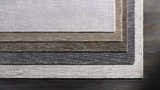 Close-up of Fochabers Premium Area Rug in black and gray tones. Hand-loomed cotton and viscose rug texture detail. Styleshot