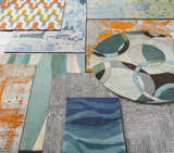 Assorted Jarratt Modern Wool Rugs in geometric, abstract, and striped patterns, featuring cream, green, gray, and orange hues. Styleshot