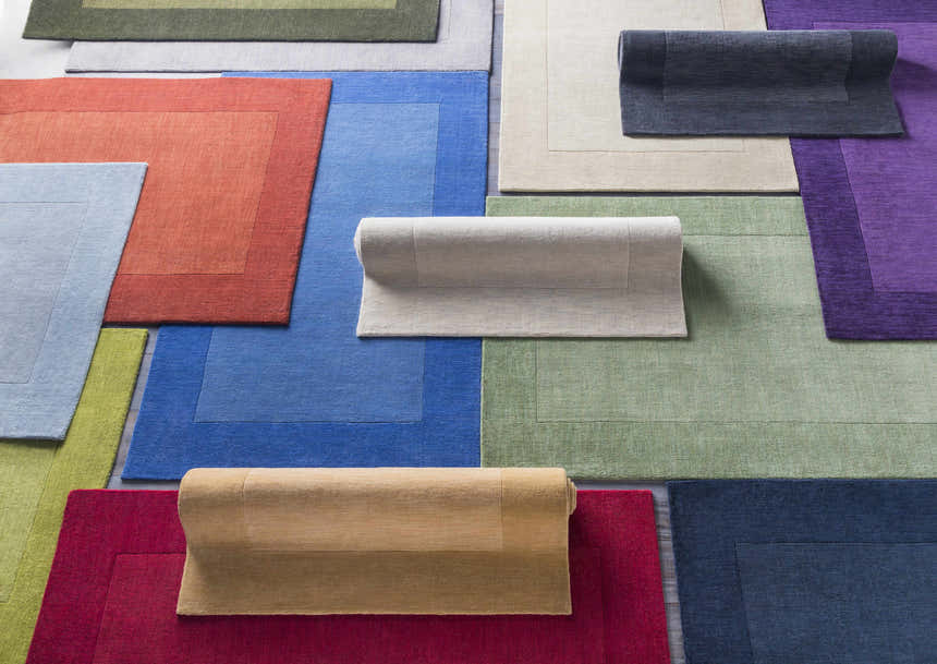 Variety of colorful hand-loomed wool rugs, including the Macedon Blue Bordered Wool Rug, in solid contemporary styles. Styleshot