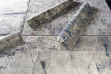 Close-up of the Gasquet Gray Marble Textured Luxe Rug, showing charcoal, blue, and gray abstract marble-like design. Styleshot