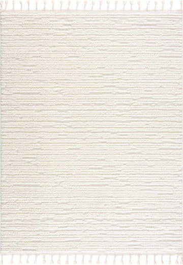 Close-up of the Kulu Textured Area Rug in cream, featuring a subtle geometric pattern and decorative tassels. Design-Rectangle-537