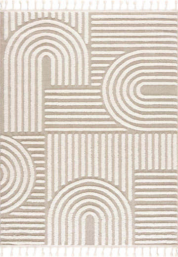 Close-up of the Moise Area Rug, featuring a beige and cream contemporary geometric pattern with tassels. Design-Rectangle-46