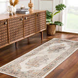 Entryway with a beige Hillcrest Area Rug runner, wood console table, and monstera plant. Roomscene-Runner