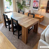Dining room scene with a wood table and the Naja Washable Area Rug in dark brown, gray, and tan tones. Roomscene-Rectangle