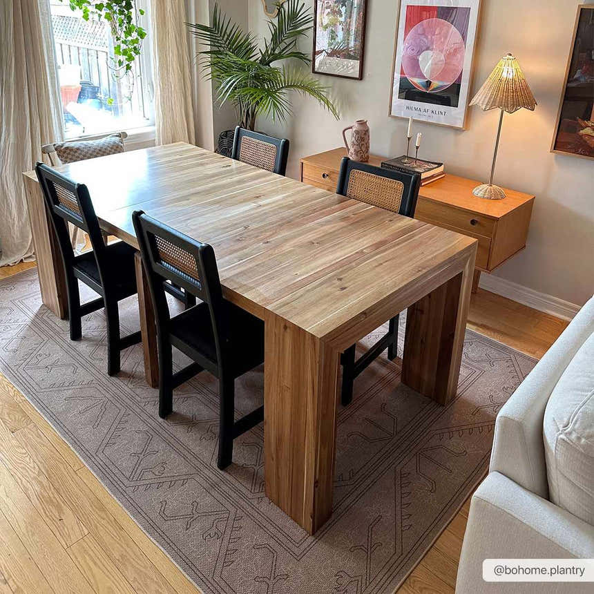 Dining room scene with a wood table and the Naja Washable Area Rug in dark brown, gray, and tan tones. Roomscene-Rectangle