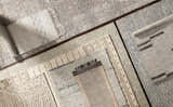 Close-up of multiple Delahey Area Rugs in charcoal, cream, and tan with contemporary patterns and textures. Styleshot