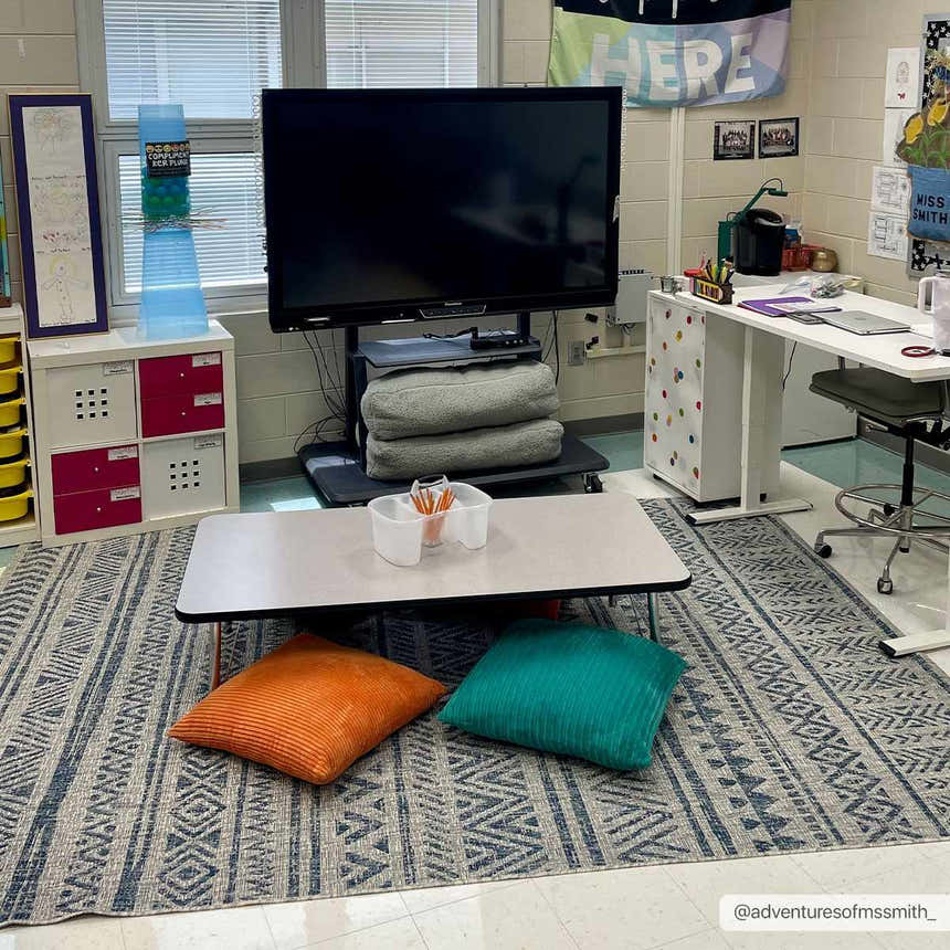 Classroom scene with a Novato All Over Pattern Performance Rug, floor cushions, table, and educational decor. Roomscene-Rectangle