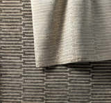 Close-up of the hand-knotted Partlow Area Rug. Beige and cream viscose rug with a contemporary geometric pattern. Styleshot