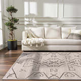 Living room scene with cream sofa and Azzan Cream & Charcoal Area Rug, featuring Southwestern design. Roomscene-Rectangle