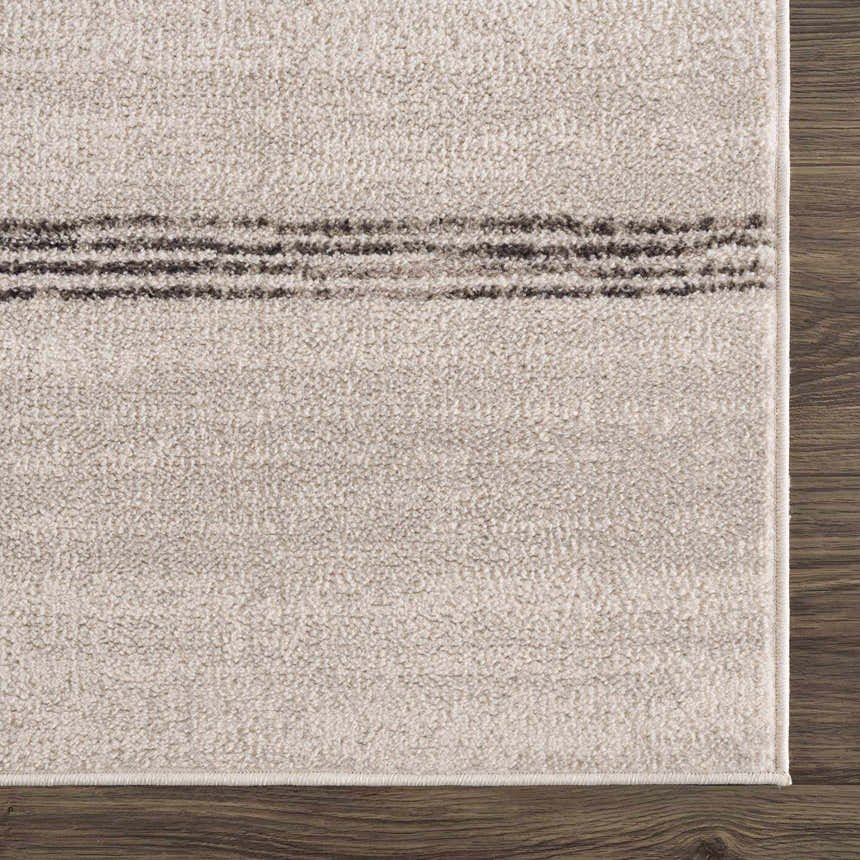 Close-up of the Deja Cream & Charcoal Area Rug showing the cream texture and charcoal stripe pattern. Swatch